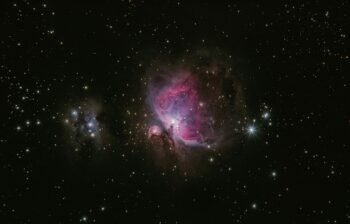 two stars in the middle of a black sky